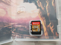 Nintendo Switch lite, with Game, and case (Zelda breath of the w