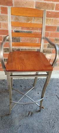 Set of four high wooden chairs with a wall fitting table