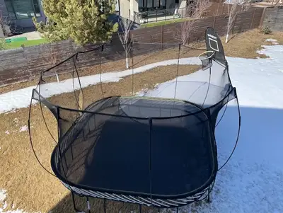 Springfree Jumbo Square trampoline - 13ft x 13ft. Comes with basket ball net and step. Purchased new...