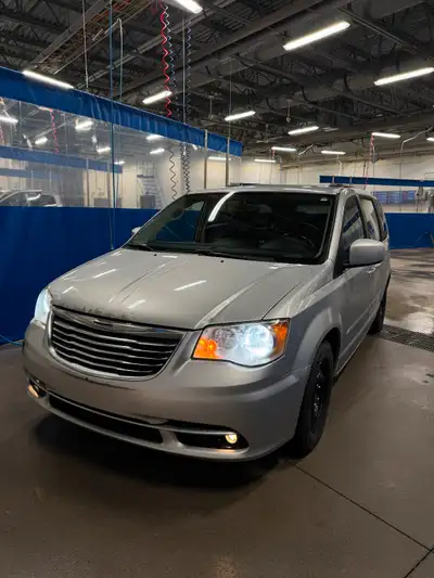 Mechanically sound silver Town and Country minivan. Below is a list of pros and cons of the vehicle....
