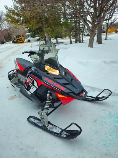 The Rush 800 has adjustable PRO-RIDE Walker Evans suspension front and rear. The engine is a fuel in...