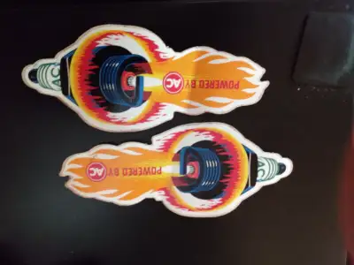 Hi. I have up for sale 2 one left and one right 1970’s Vintage AC Fire-Ring Spark Plug Vinyl Adverti...