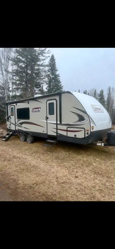 The 2019 Coleman travel trailer, very little use, features a front queen bed, a rear kitchen, one sl...