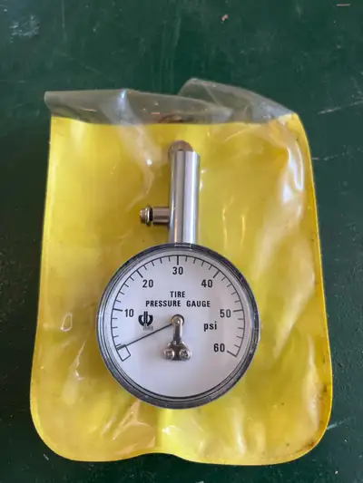 This is a new old stock tire pressure gauge that reads up to 60 psi. The gauge is in pristine condit...