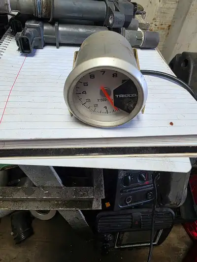 This is a used TRISCO tachometer, a helpful device that measures the revolution rate of an engine's...