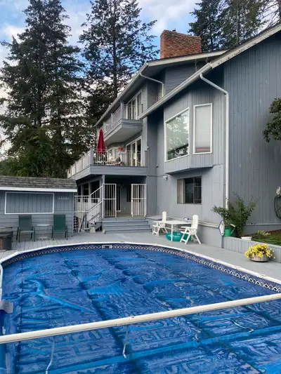 West Kelowna, lake, city, and mountain view, walk out level of 3 level home, backing onto wooded par...
