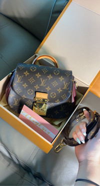 Louis Vuitton Eden leather bag