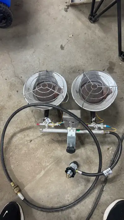 Functional propane tank top heaters. Has two heaters. Includes hose and regulator. Was around $160