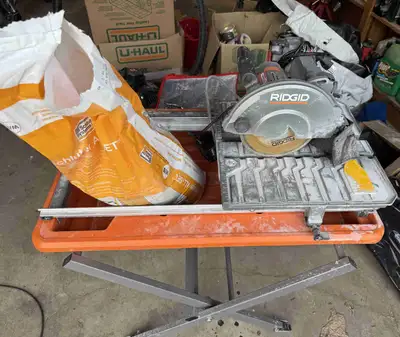Rigid wet saw with table. Just used to do my shower. Comes with left over Schluter all set.