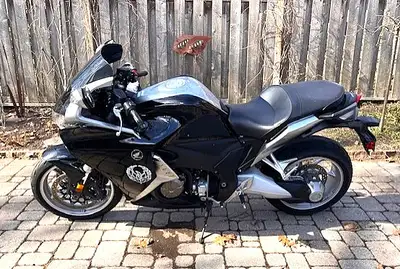 Honda VFR1200. Belonged to my late husband. Custom seat, windshield. Stored in bike garage. XL Klim...