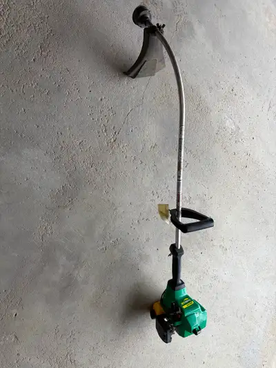 Weed Eater FeatherLite lawn trimmer. 18cc Needs a new primer, gas line and maybe a new tank. Still h...