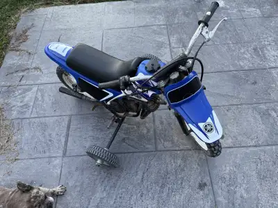 Selling my PW 50 dirt bike Perfect for kids Runs well Training wheels on it Seats in great shape Loc...