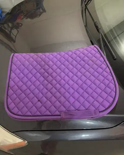 Saddle pads for sale Purple pad (pony) - $25 Yellow pad (pony) - $15 Navy Blue pad (horse or large p...