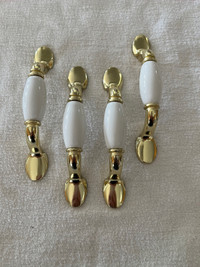 4 gold and white door or cabinet pulls handles
