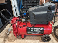 Husky 8 Gallon Air Compressor with hose. 