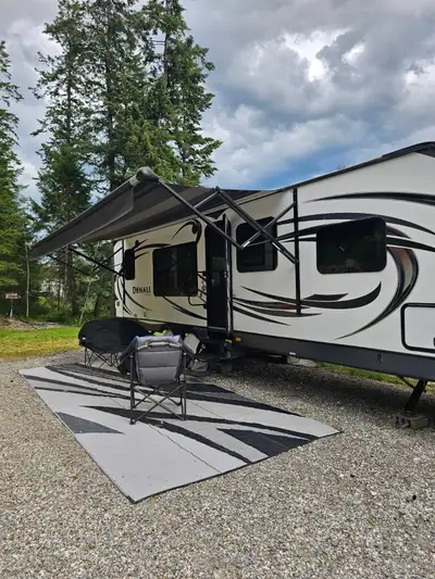 Well maintained travel trailer for sale. One bedroom, U shaped dinette, couch, fireplace and one rec...