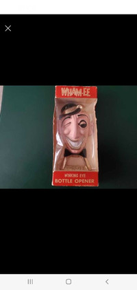 Antique WHAM-EE Winking man cast iron opener