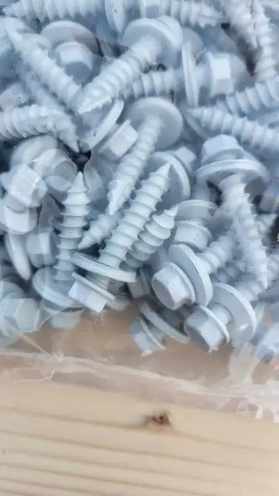 Sheet metal screws for sale All screws have rubber washer $45 per bag 250 screws #14 1¼" Bone white...