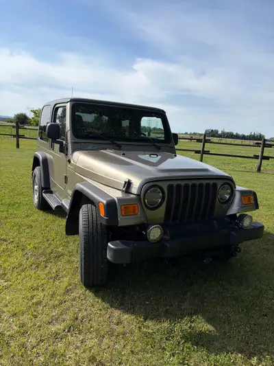 2004 Jeep Wrangler TJ Sport with a 4.0L inline-6 cylinder engine coupled with a 5-speed manual trans...