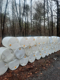 WHITE 45 gallon plastic barrels