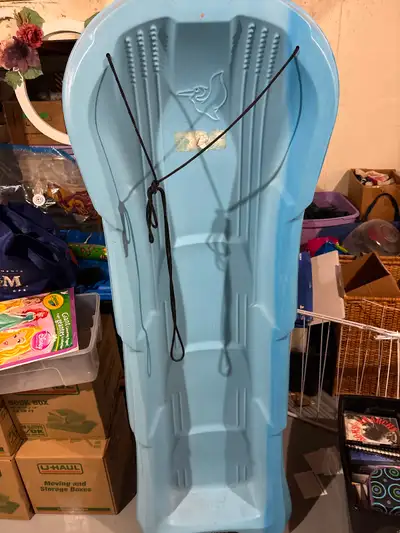Get ready for winter fun with this pre-owned Pelican toboggan, perfect for sliding down snowy hills....