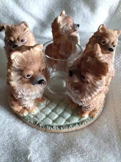 Lovely circle of Pomeranians surrounding a candle center. Great gift idea.