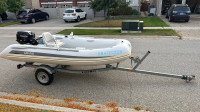 Grand inflatable boat with motor, trailer and lots of extras