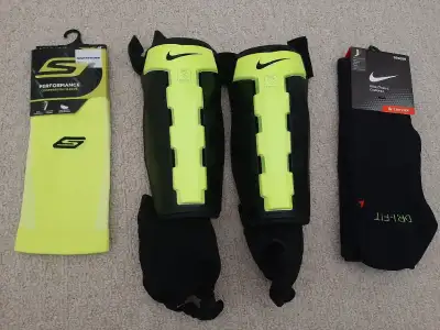 Nike Shin pads size L $15 , Black Nike Over the calf. Size 3Y- 5Y. $10. Sckechers performance compre...