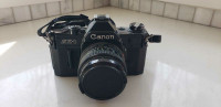 AE-1 Black body Canon SLR with 2.8 50mm lenses and strap