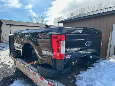 Mint condition Line-X'd inside with fifth wheel hitch and power plugs Tonneau cover and tailgate wit...