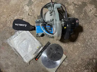 Delta Compound Miter Saw (8 1/4" - Model 36-040C) with extra blades.