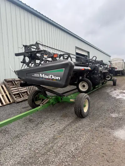 35ft. John Deere hookup. Flip over reel. Knives and guards in good shape. No tears on belts. No leak...