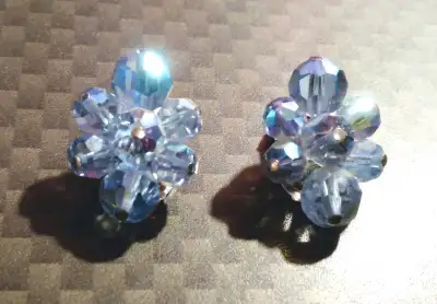This is a lovely pair of earrings in the Aurora Borealis crystal invented in 1956 by Manfred Swarovs...