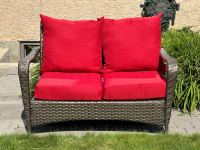 Outdoor wicker sofa with cushions
