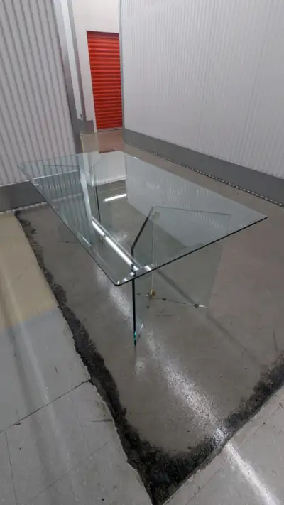 Make a bold statement in your home with this contemporary glass dining table! Details: Condition: Us...
