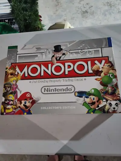 I'm selling a used Nintendo Monopoly Collector's Edition board game, a fast-dealing property trading...