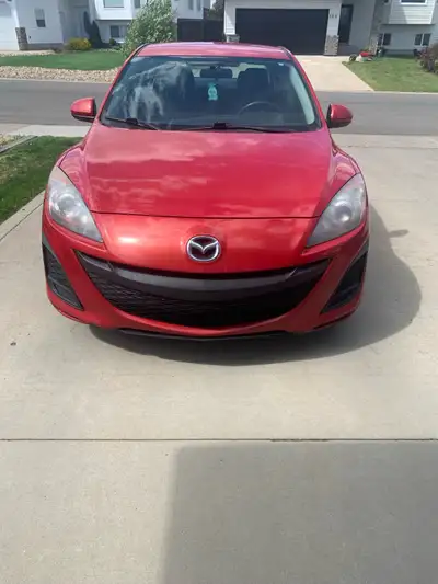 2010 Mazda 3, 4 Door Sedan, Red.