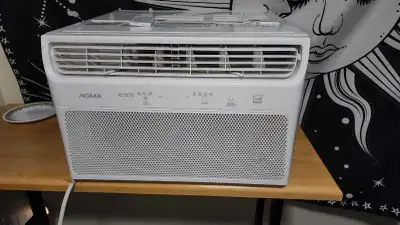This AC has a remote and a removeable filter hatch on the front. Item: https://www.canadiantire.ca/e...