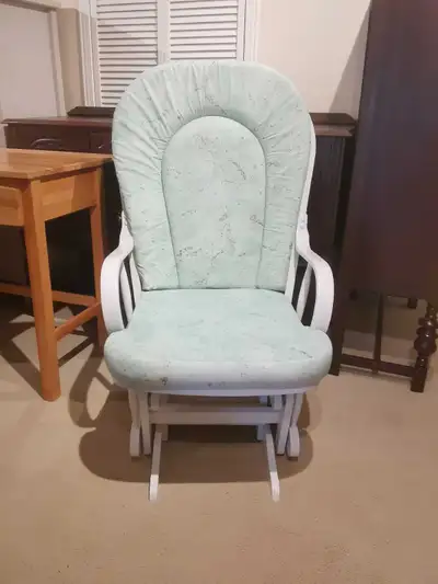 Sale a great condition solid wood glider rocking chair with washable coushion, very sturdy and comfo...