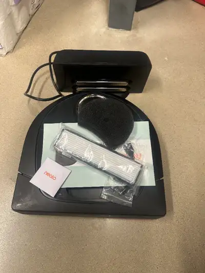 Used but still fully functional Neato Botvac with charging stand. Connects via app to your phone for...