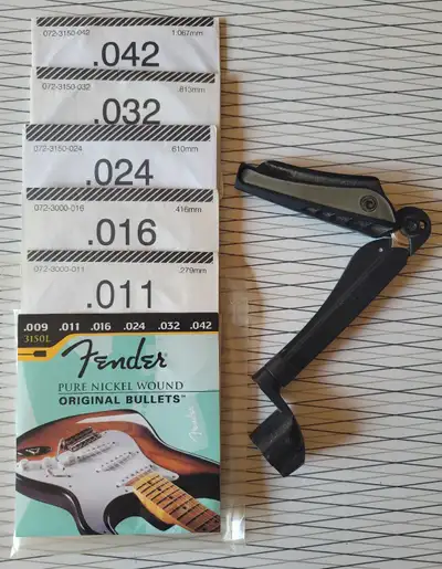 Fender Electric guitar strings, picks, strap and winder, View more