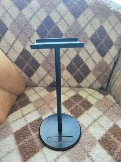 This sleek, black headset stand is perfect for keeping your gaming or music headphones organized and...