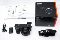 Sony a6500 camera body with 16-50mm kit lens and extra charger