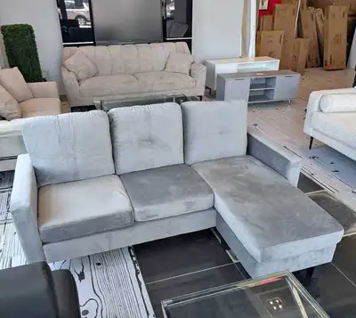 This is a used sectional sofa with a chaise lounge, perfect for lounging and adding a modern touch t...