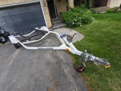Like new jet boat trailer. Used for a 2004 Sportster. Bunks measure: across - 40" long - 84" - leaf...