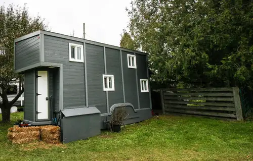 This fully insulated tiny home offers an exceptional living experience, seamlessly blending modern c...