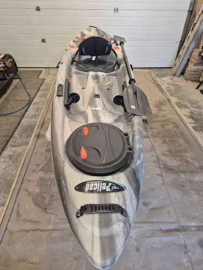 For sale: 12 foot long, 32 inch wide Pelican Strike 120x Angler Kayak with paddle and homemade wheel...