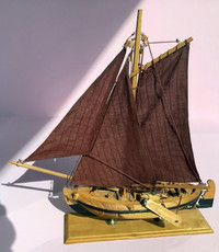Wooden Sailboat Model with Brown Sails