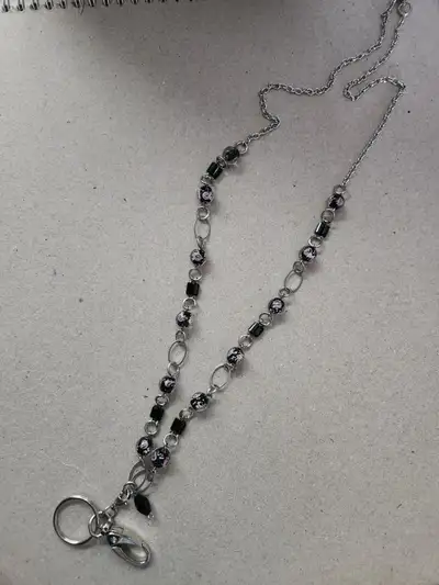 We have a silver lanyard necklace silver for sale asking $20.00 CASH for pick up only brand new neve...