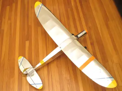 Nice looking plane with semi-elliptical wingtips, covering in a mirror-like film with accent stripes...